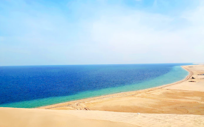 Khor Al Adaid desert meeting the sea in Doha, Qatar.