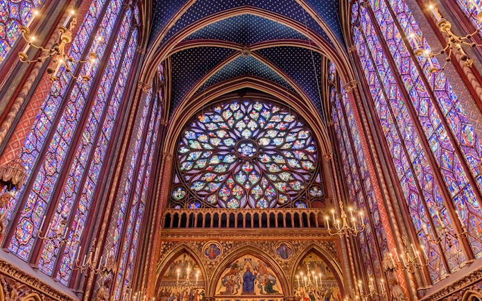 Stained glass windows and rose window inside Sainte Chapelle, Paris.