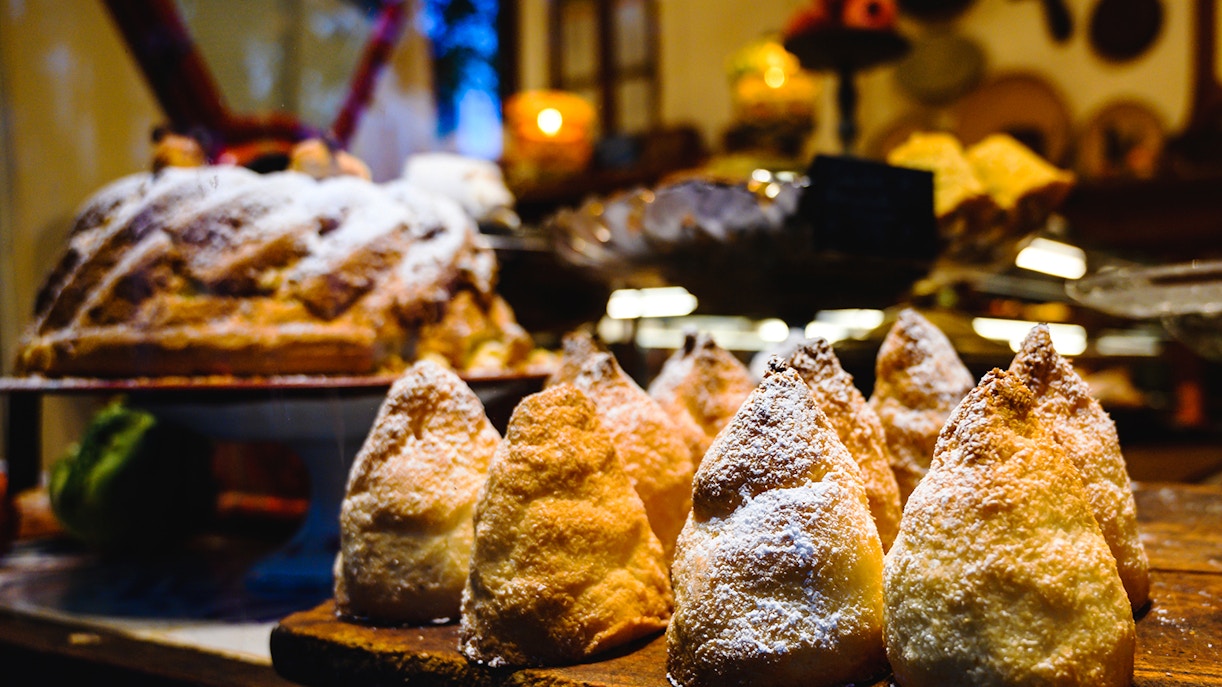 La Lonja district street scene in Mallorca with outdoor café and tourists exploring.