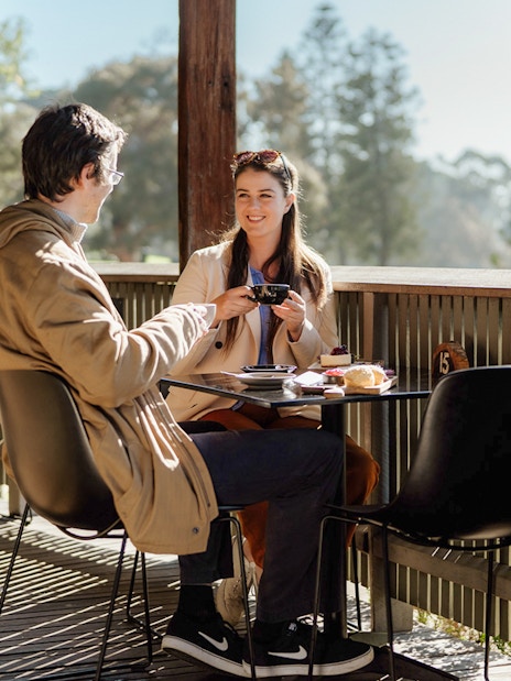 Couple enjoying coffee at a cafe on Churchill Island.