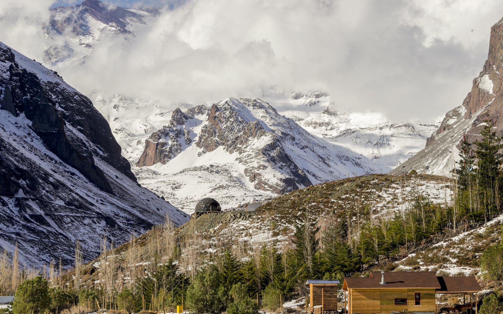 Lodge El Morado nestled in the snow-capped Andes Mountains, Cajón del Maipo, Chile.