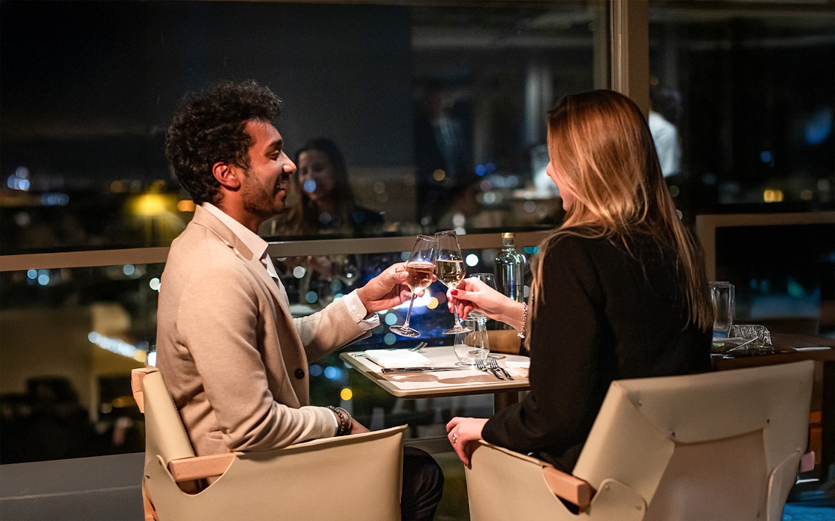 Couple dining at Madame Brasserie, Eiffel Tower, Paris.