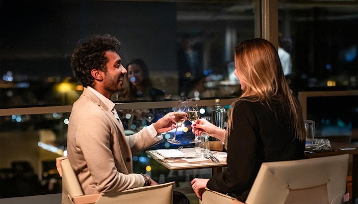 Couple dining at Madame Brasserie, Eiffel Tower, Paris.