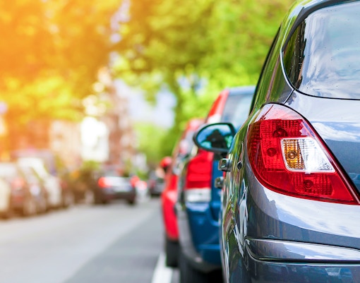 Monserrate Palace parking area with surrounding lush greenery in Sintra, Portugal.