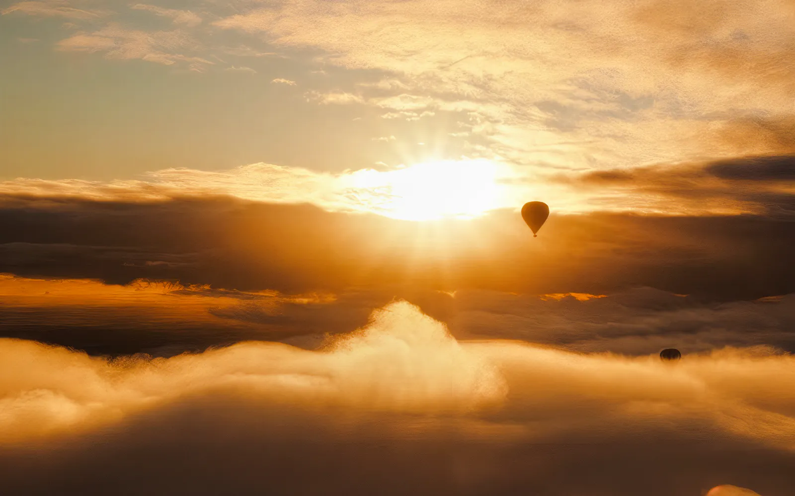 Hot air balloon over Avon Valley at sunrise.
