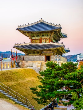 Suwon Hwaseong fortress gate at sunset, South Korea.