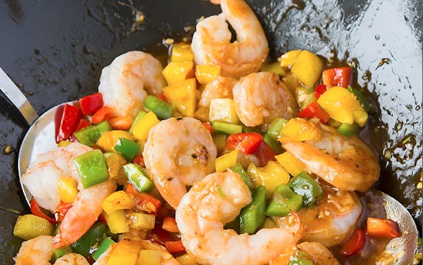 Shrimp stir-fry with colorful bell peppers at Silom Thai Cooking School.