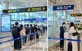 Passengers in line at Hanoi Noi Bai Airport for immigration and fast track services.