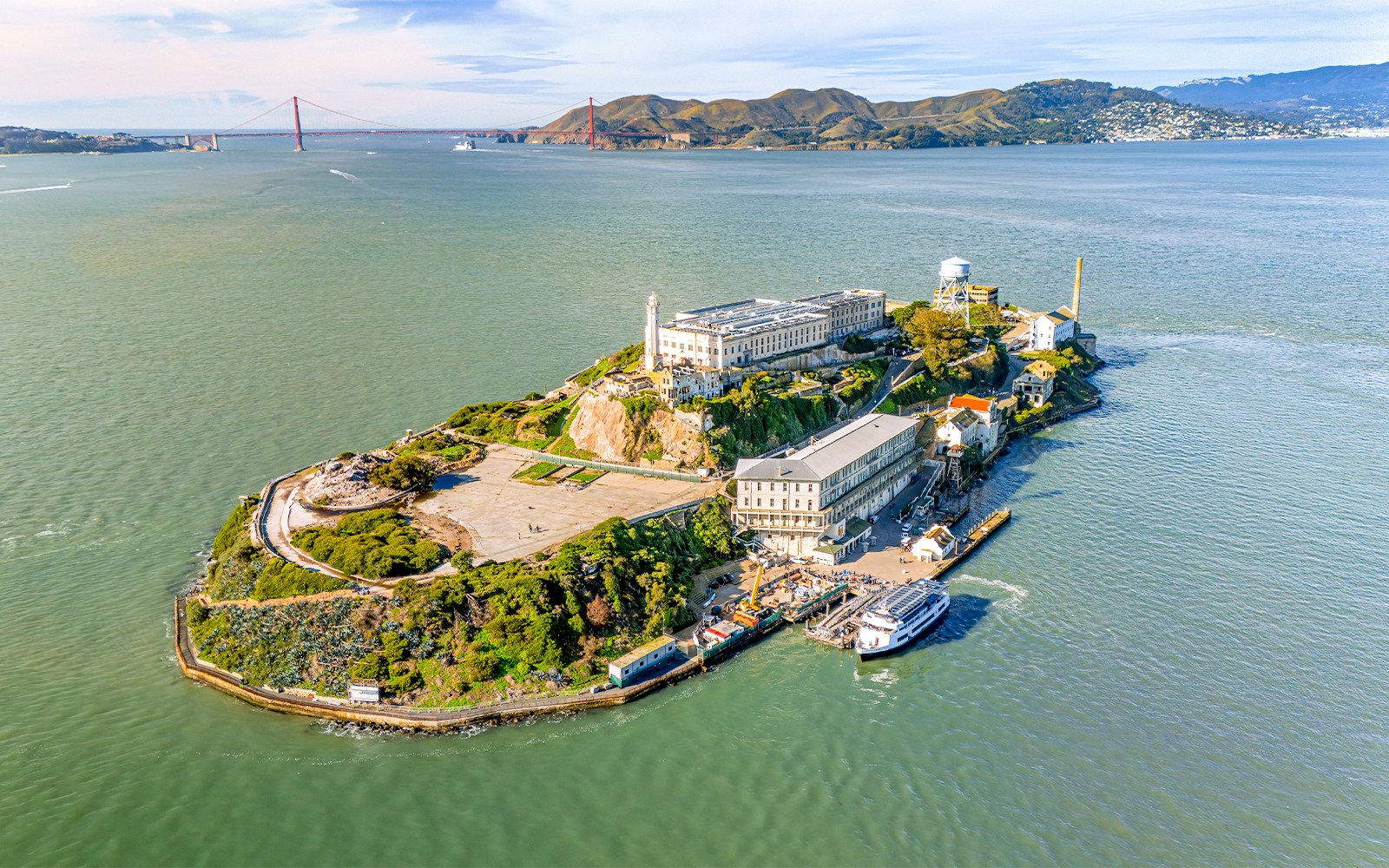 Aerial view of Alcatraz Island with ferry approaching in San Francisco Bay, USA.