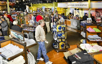 Grand Canyon IMAX gift shop with visitors browsing souvenirs and apparel.