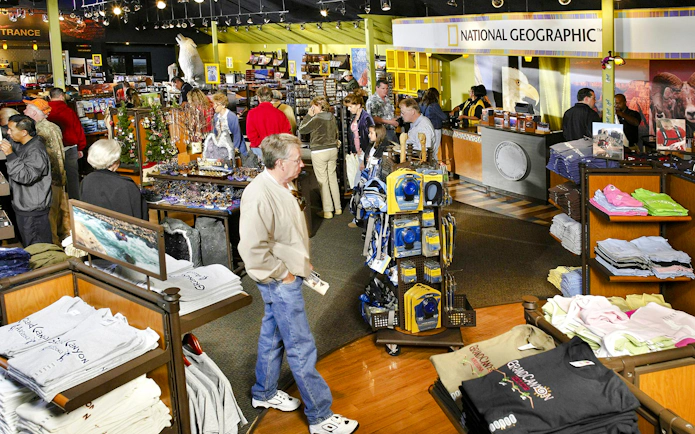 Grand Canyon IMAX gift shop with visitors browsing souvenirs and apparel.