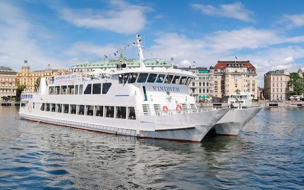 Stockholm archipelago tour boat near city waterfront.