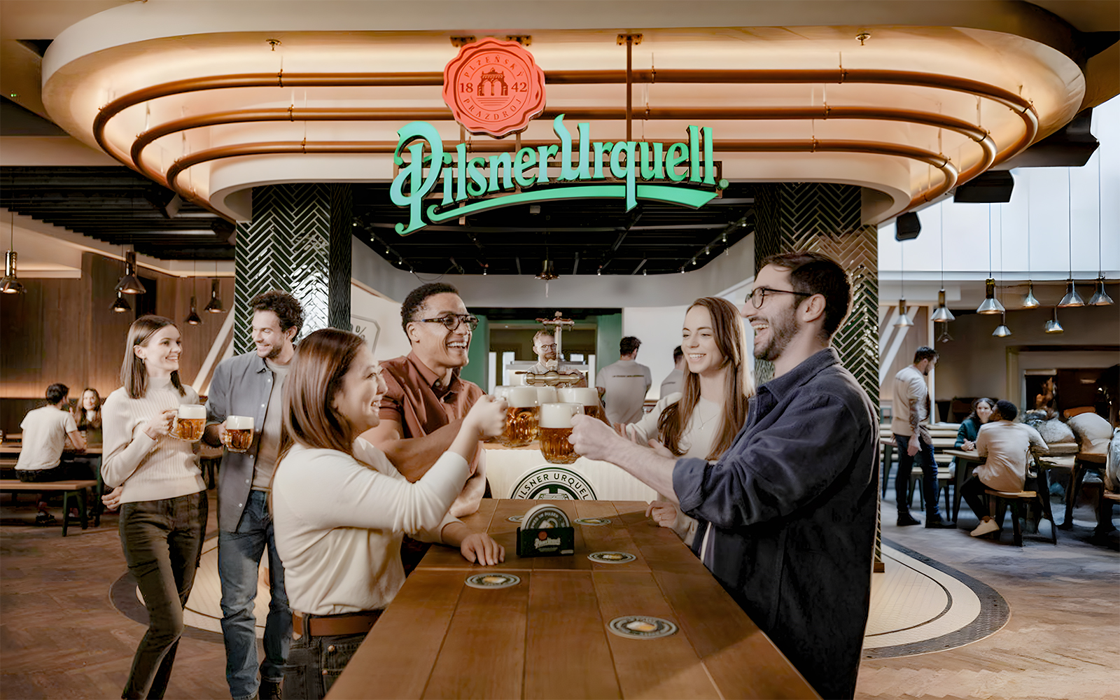 Tourists enjoying beer at Pilsner Urquell The Original Beer Experience.