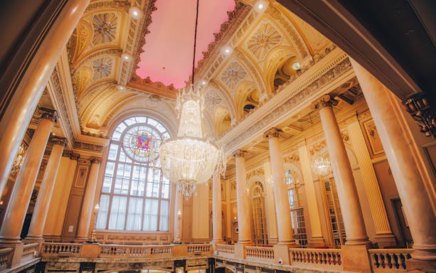 Grand interior of Chicago Theatre with ornate ceiling and chandelier on State Street.
