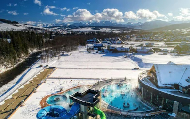 Thermal baths with snowy mountains in Zakopane, Poland, part of a day trip from Kraków.
