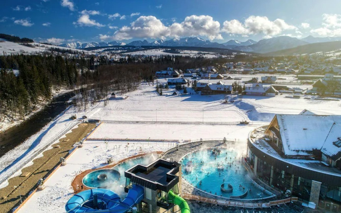 Thermal baths with snowy mountains in Zakopane, Poland, part of a day trip from Kraków.