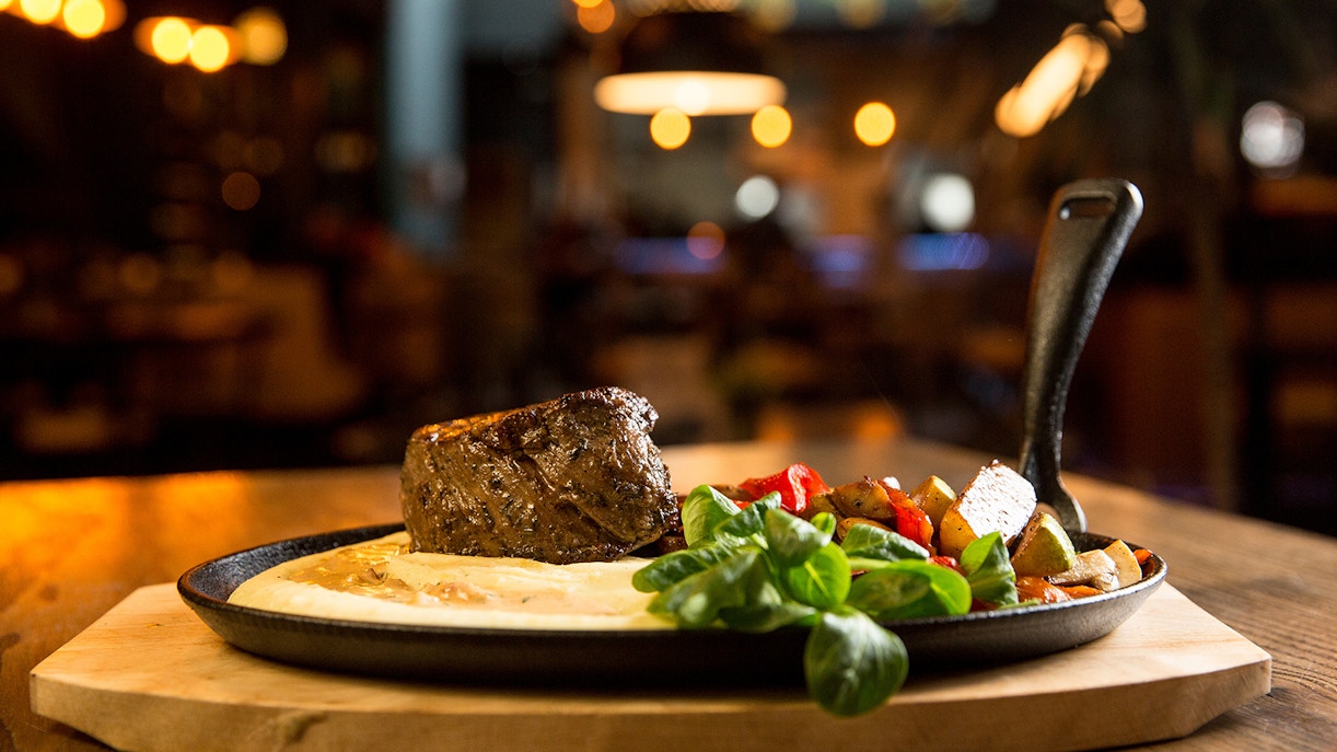 Gillray's Steakhouse & Bar dining area with view of London Eye in background.