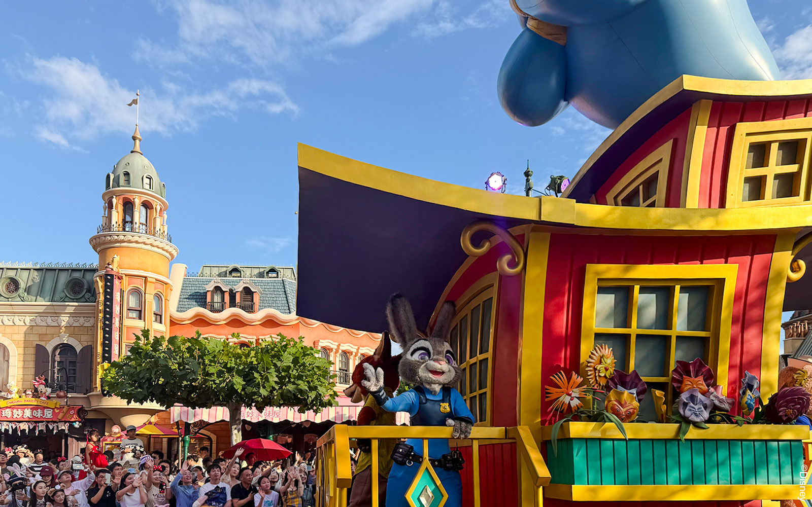 Disney Adventure Friends Cavalcade with Judy Hopps on a colorful parade float.