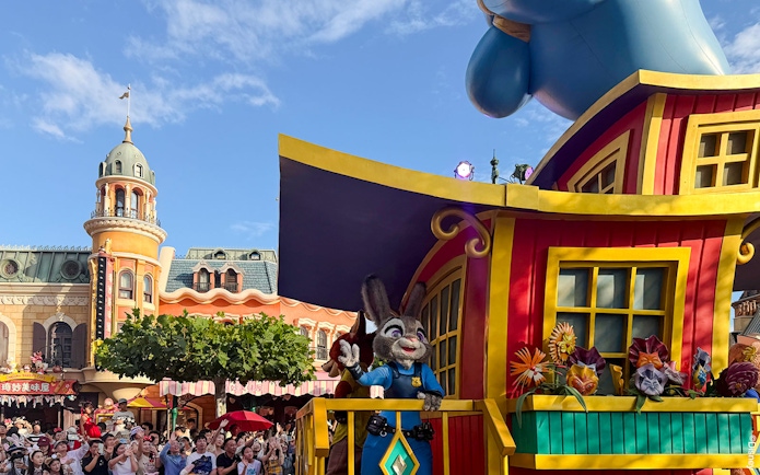 Disney Adventure Friends Cavalcade with Judy Hopps on a colorful parade float.
