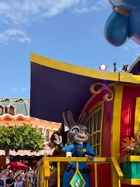 Disney Adventure Friends Cavalcade with Judy Hopps on a colorful parade float.
