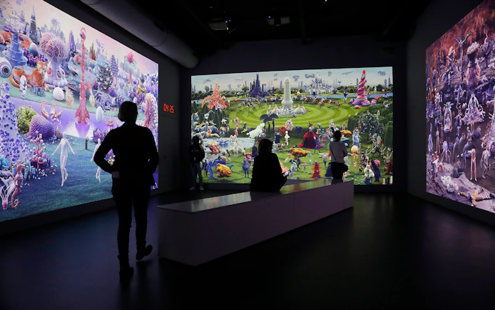Guests viewing digital art at Remastered audiovisual experience in Rotterdam.