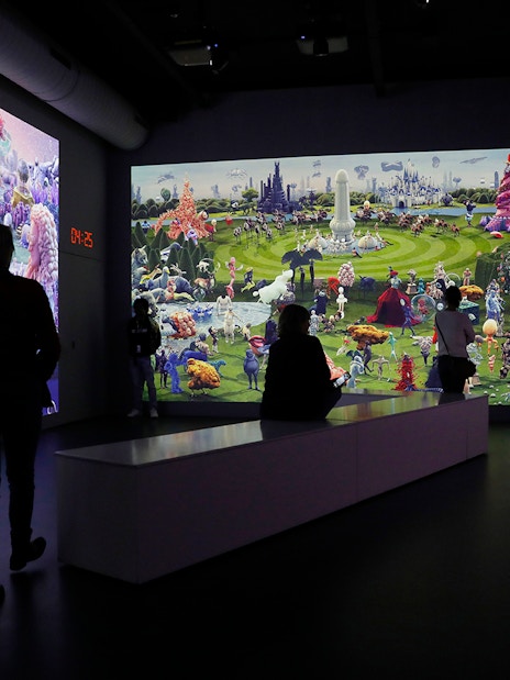 Guests viewing digital art at Remastered audiovisual experience in Rotterdam.
