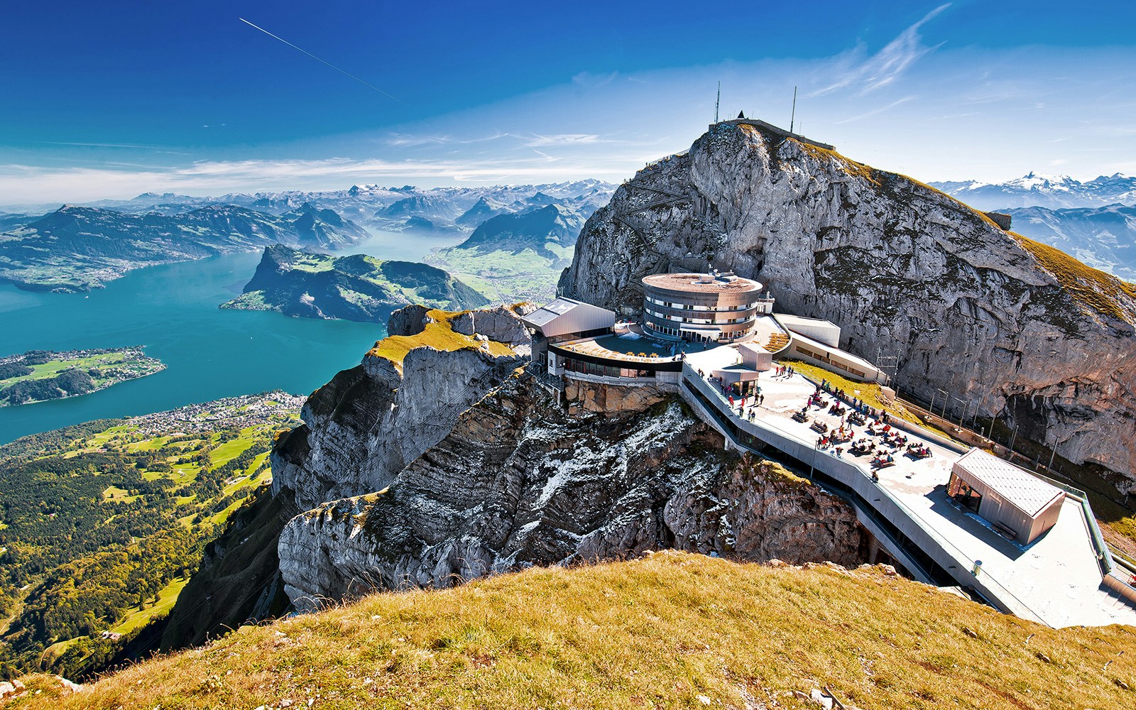 Mount Pilatus summit with panoramic view of Lake Lucerne and surrounding Alps.