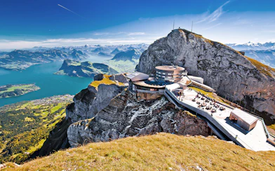 Mount Pilatus summit with panoramic view of Lake Lucerne and surrounding Alps.