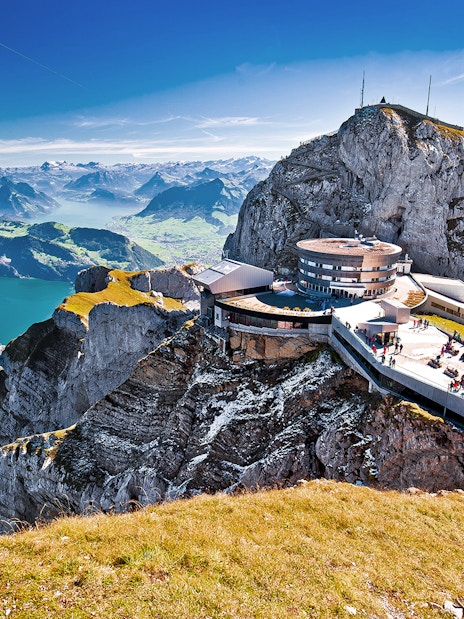 Mount Pilatus summit with panoramic view of Lake Lucerne and surrounding Alps.