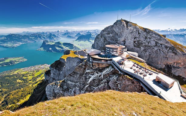 Mount Pilatus summit with panoramic view of Lake Lucerne and surrounding Alps.