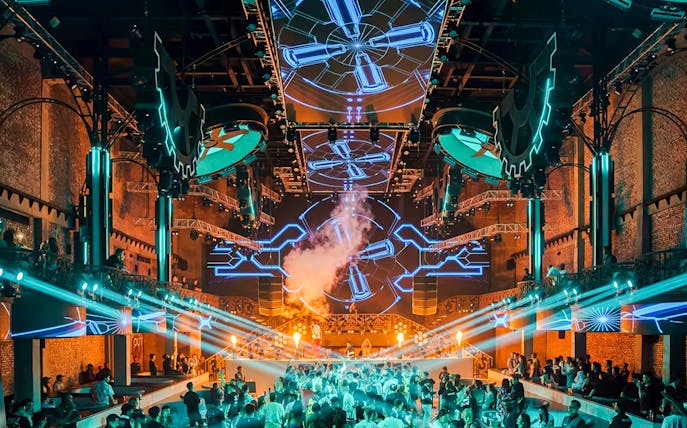 Tourists at CKay Event, Atlas Beach Club Bali, enjoying live music and beachfront views.