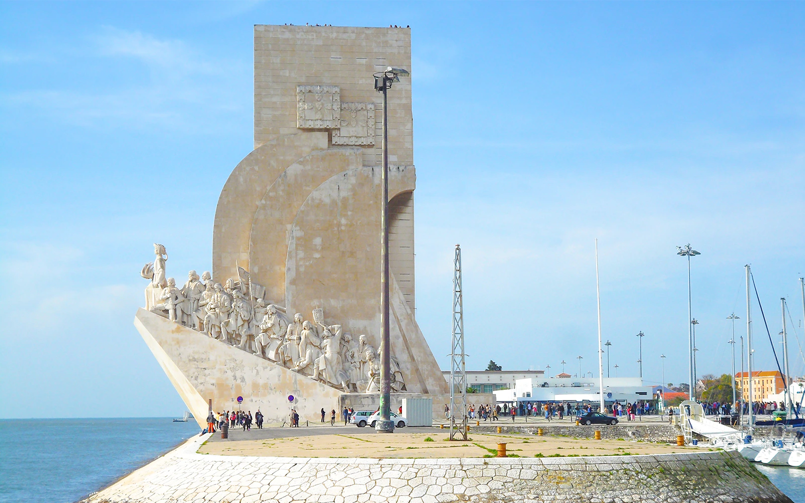 Monument to the Discoveries in Lisbon with statues of explorers by the Tagus River.