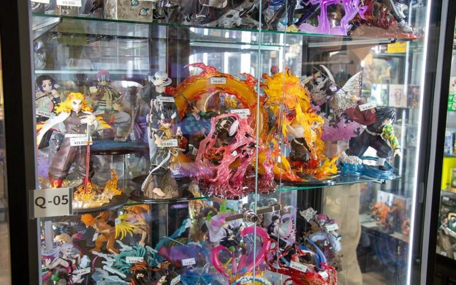 Anime figurines displayed in a glass case at Akihabara, Tokyo.