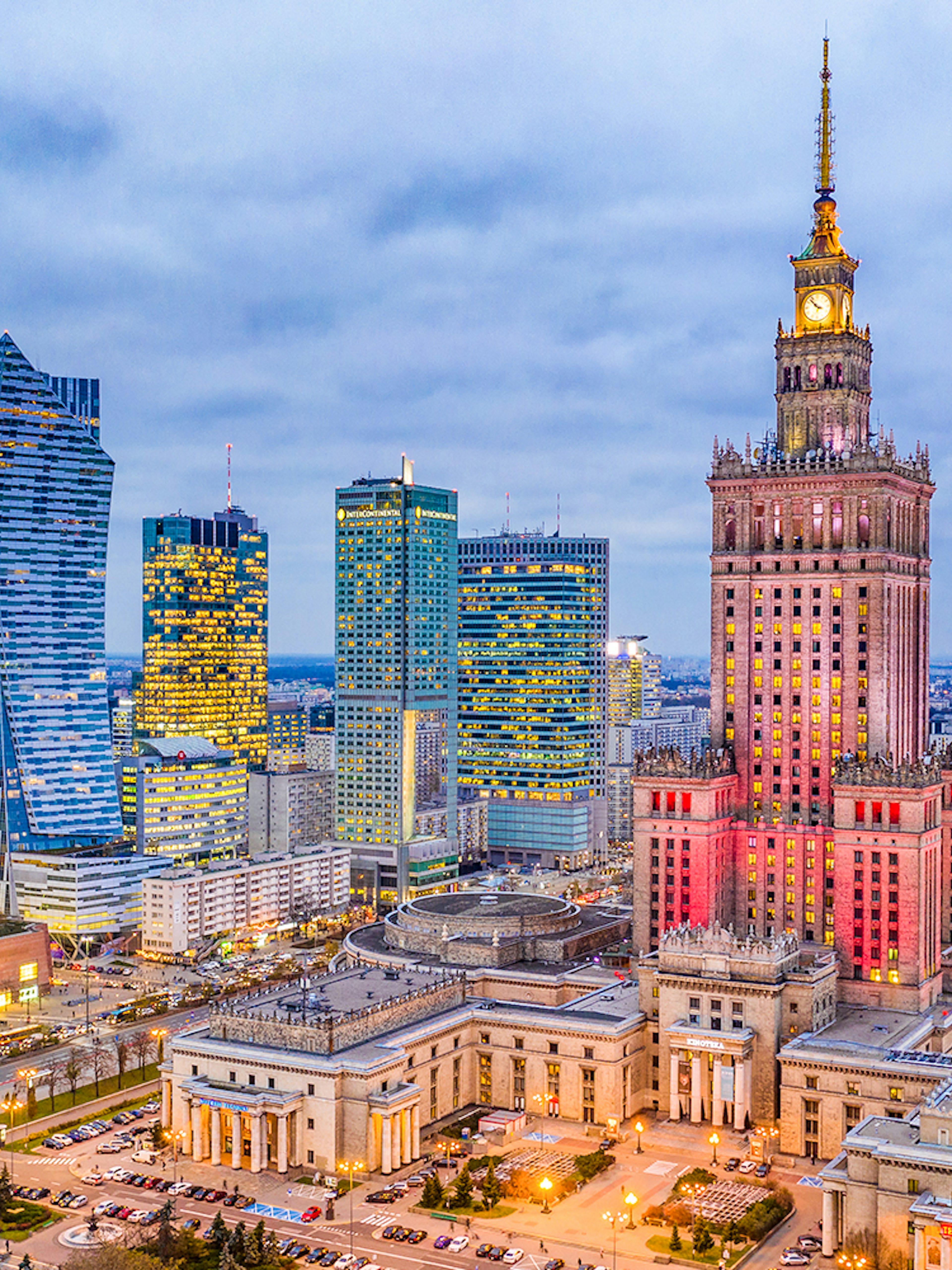 Warsaw skyline with Palace of Culture and Science at dusk.