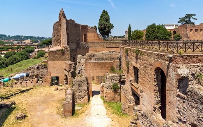 Roman Forum ruins and Palatine Hill landscape in Rome, Italy.