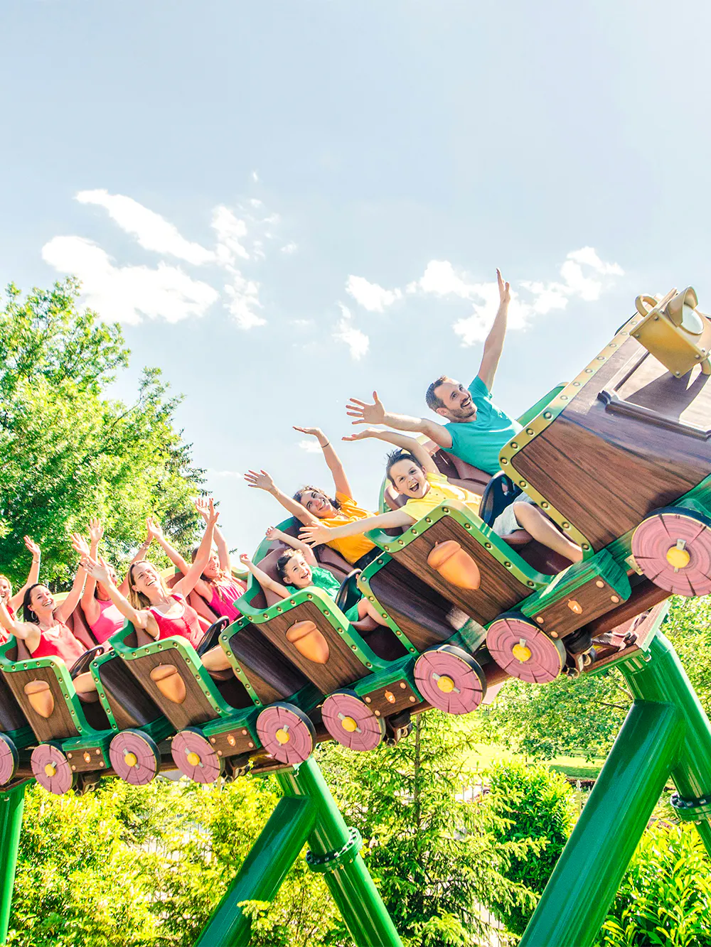 Roller coaster ride with people enjoying at Nigloland, France.