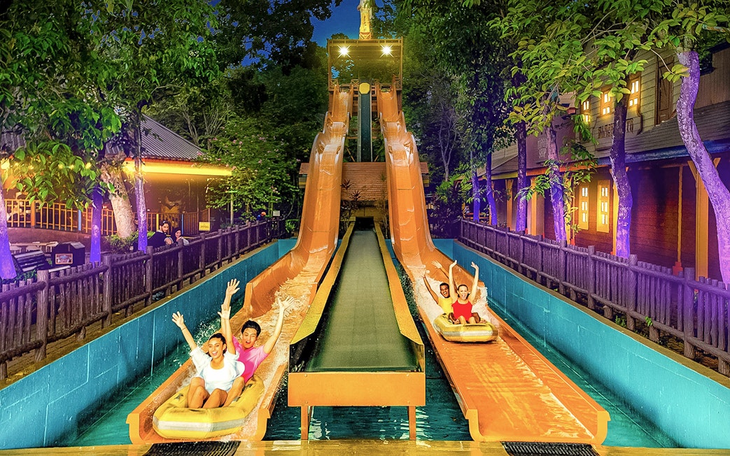 Visitors enjoying water slides at Sunway Lagoon Theme Park, Malaysia.