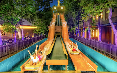 Visitors enjoying water slides at Sunway Lagoon Theme Park, Malaysia.