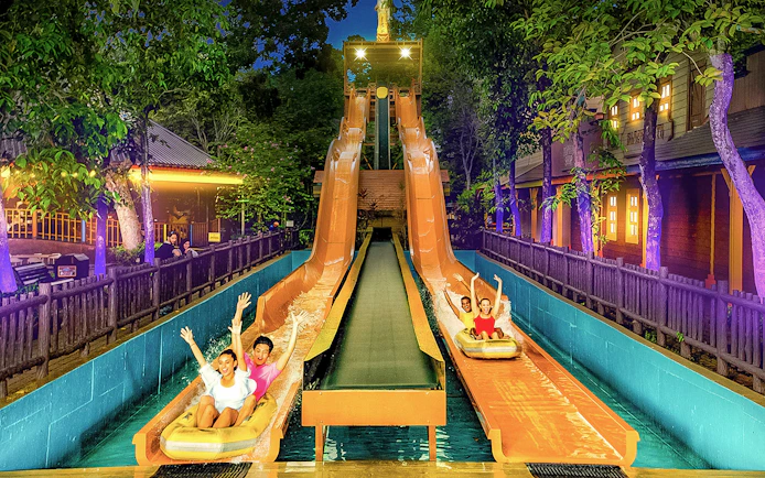 Visitors enjoying water slides at Sunway Lagoon Theme Park, Malaysia.