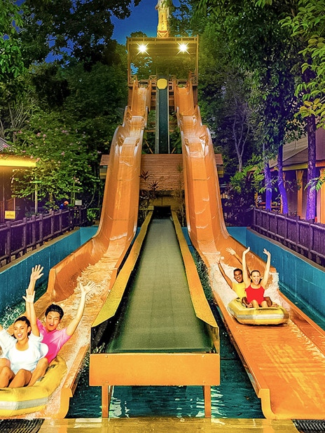 Visitors enjoying water slides at Sunway Lagoon Theme Park, Malaysia.