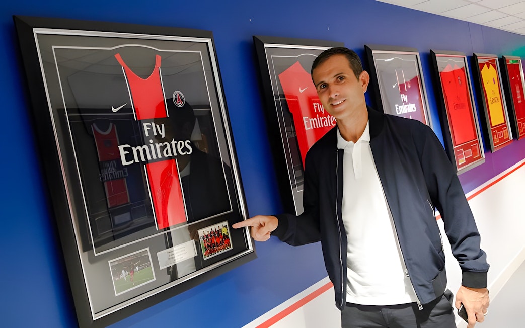 Framed PSG jersey display at PSG Stadium, Paris, France.
