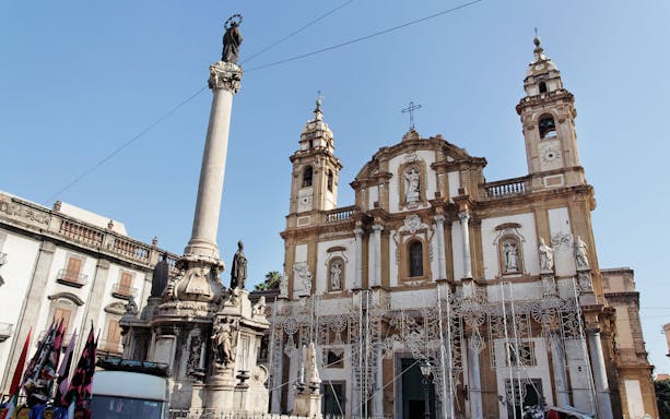 Baroque church and column in Palermo, Italy, seen on a guided bike tour with granita stop.