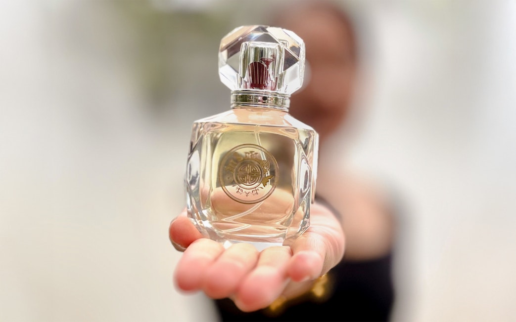 Perfume bottle held in hand at Scentopia Sentosa Singapore.