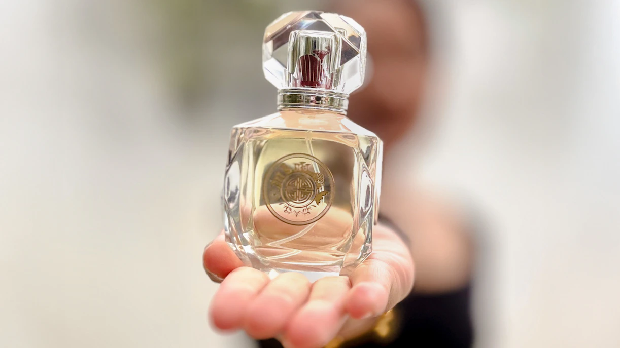 Perfume bottle held in hand at Scentopia Sentosa Singapore.