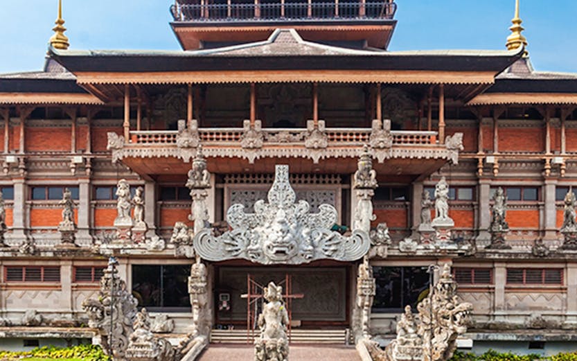 Taman Mini Indonesia aerial view showcasing traditional Indonesian architecture and lush gardens.