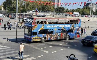 Shuttle bus for Vialand Theme Park in Istanbul at a city square.