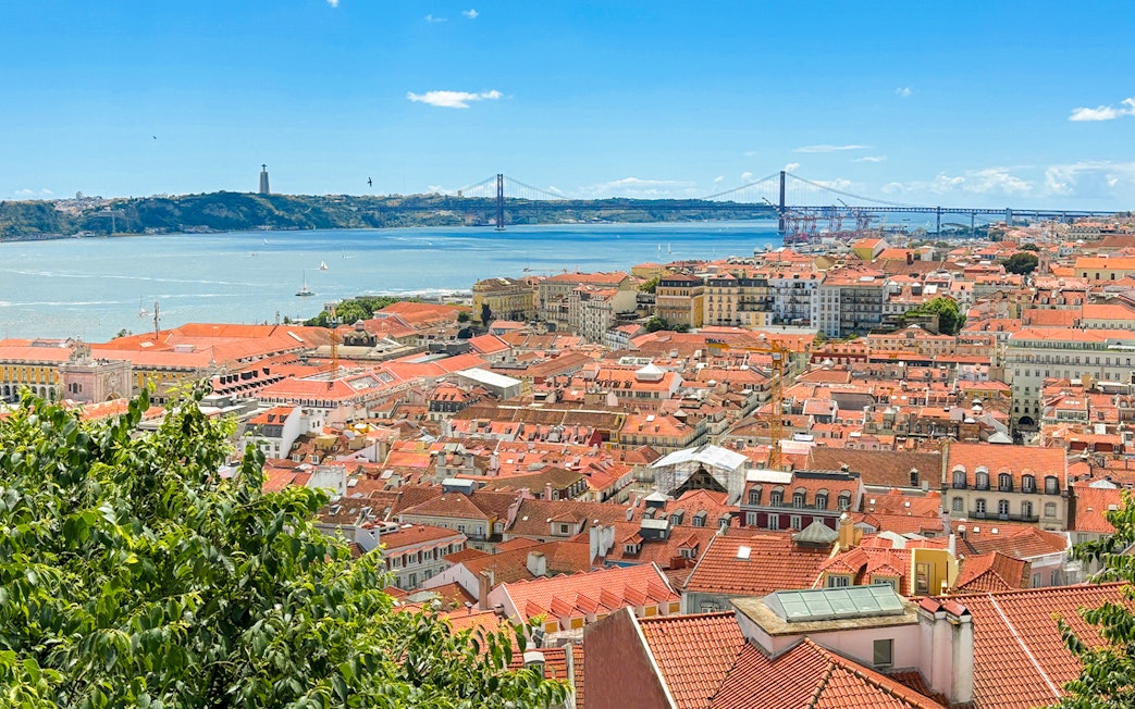 View of Lisbon rooftops and Tagus River from São Jorge Castle.