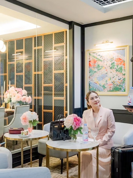 VIP lounge service at Donmuang Airport with guests being served refreshments.