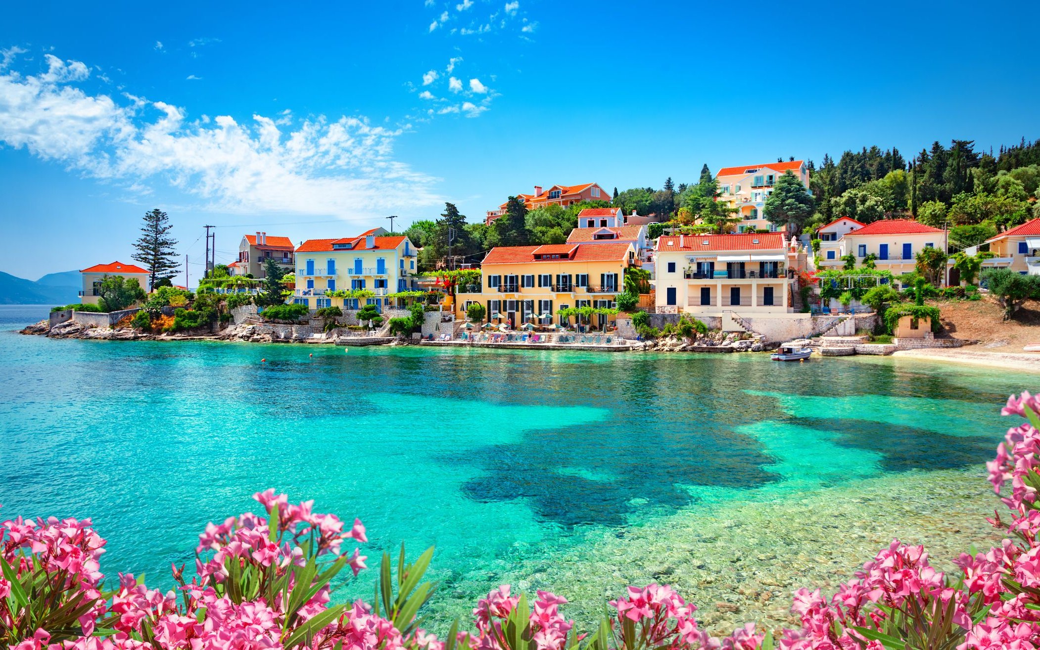Fiskardo village waterfront with colorful buildings on Kefalonia island, Greece.