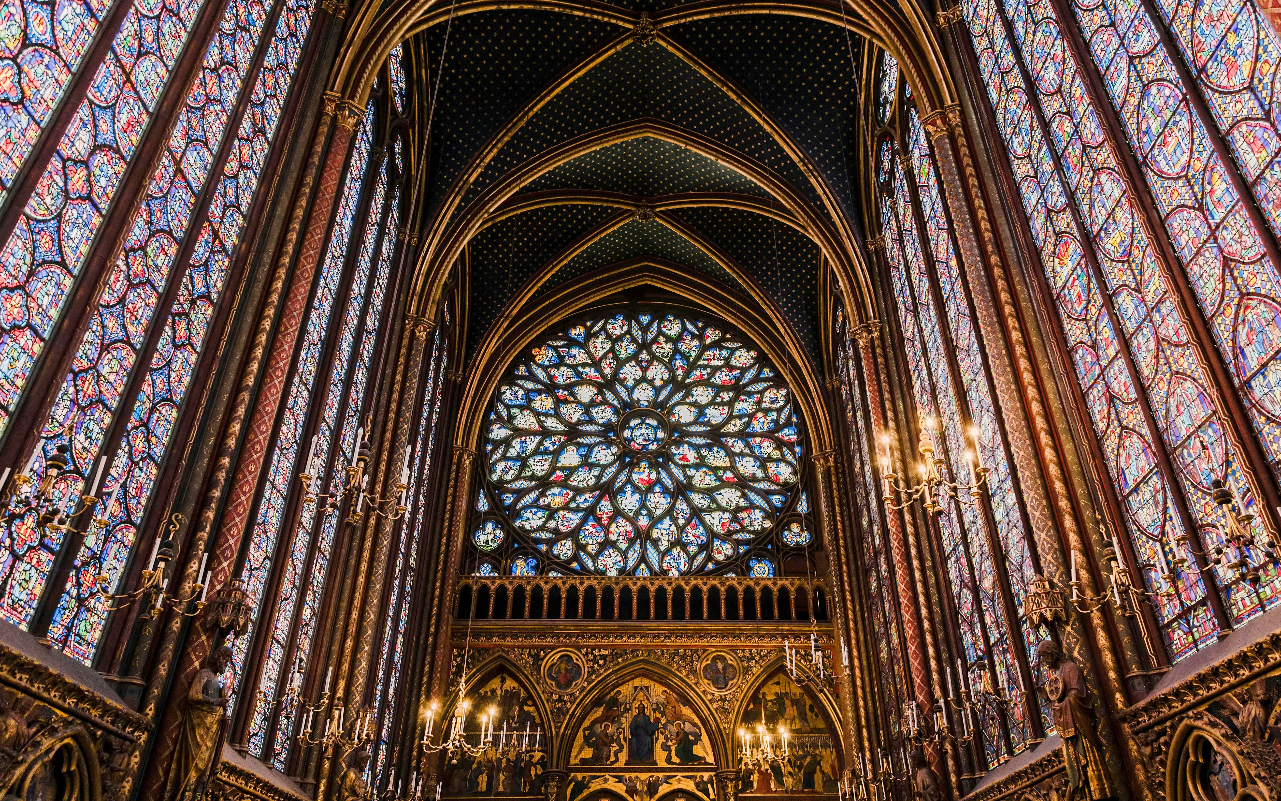 Stained glass windows and vaulted ceiling inside Sainte Chapelle, Paris.